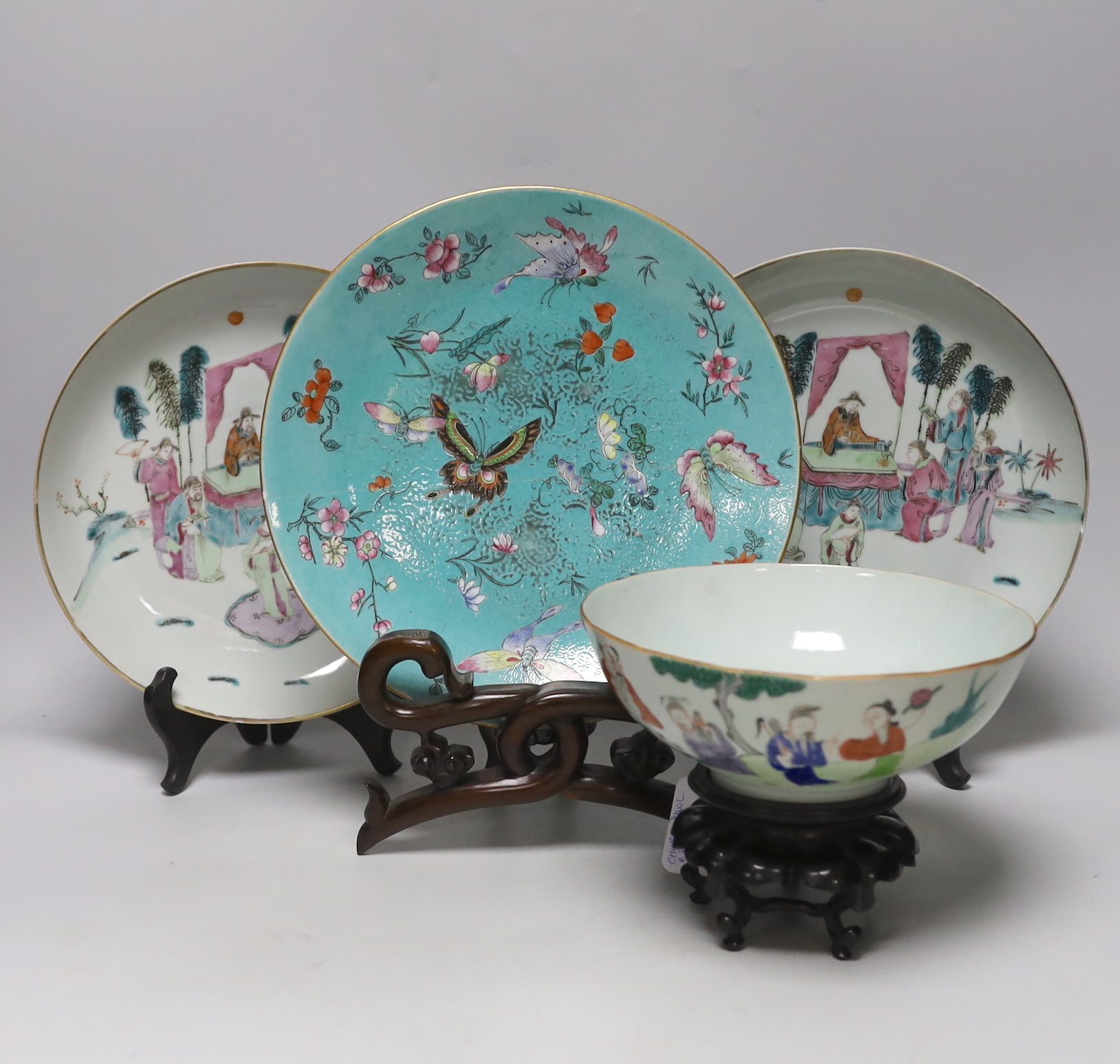 A pair of Chinese famille rose dishes painted with court scenes, a similar enamelled butterfly dish and an ‘immortals’ bowl, all 19th century